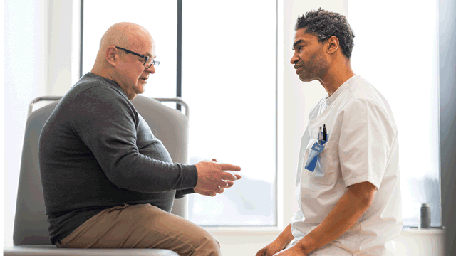 A photo of a doctor in consultation with a patient.